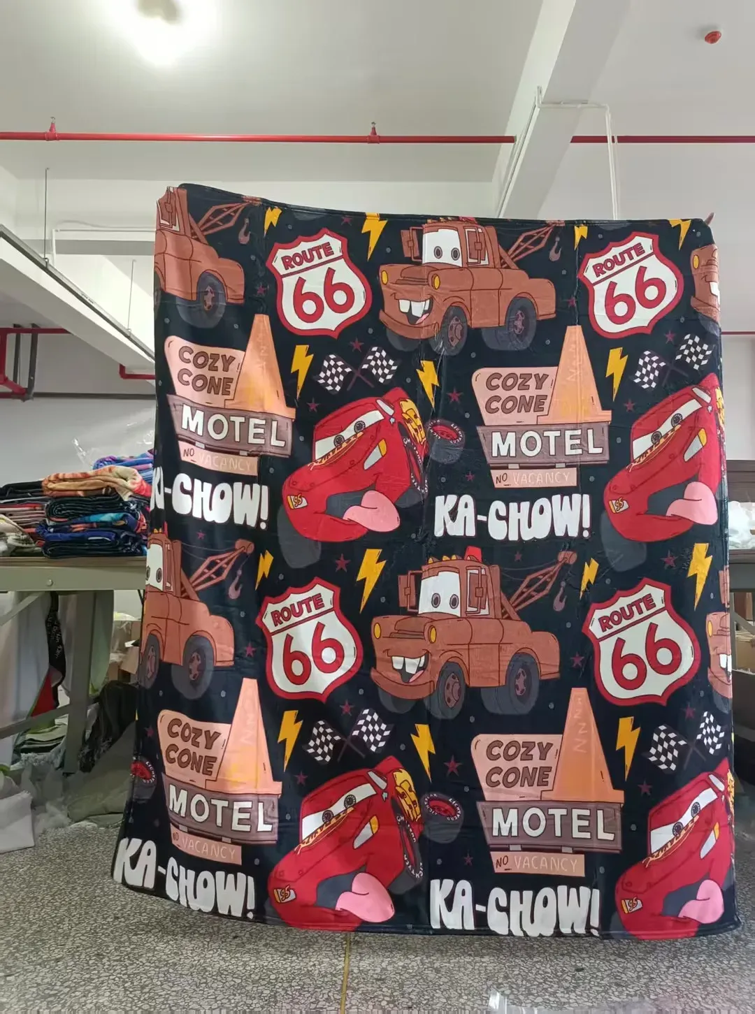 White custom blanket with repeated crest logo print pattern