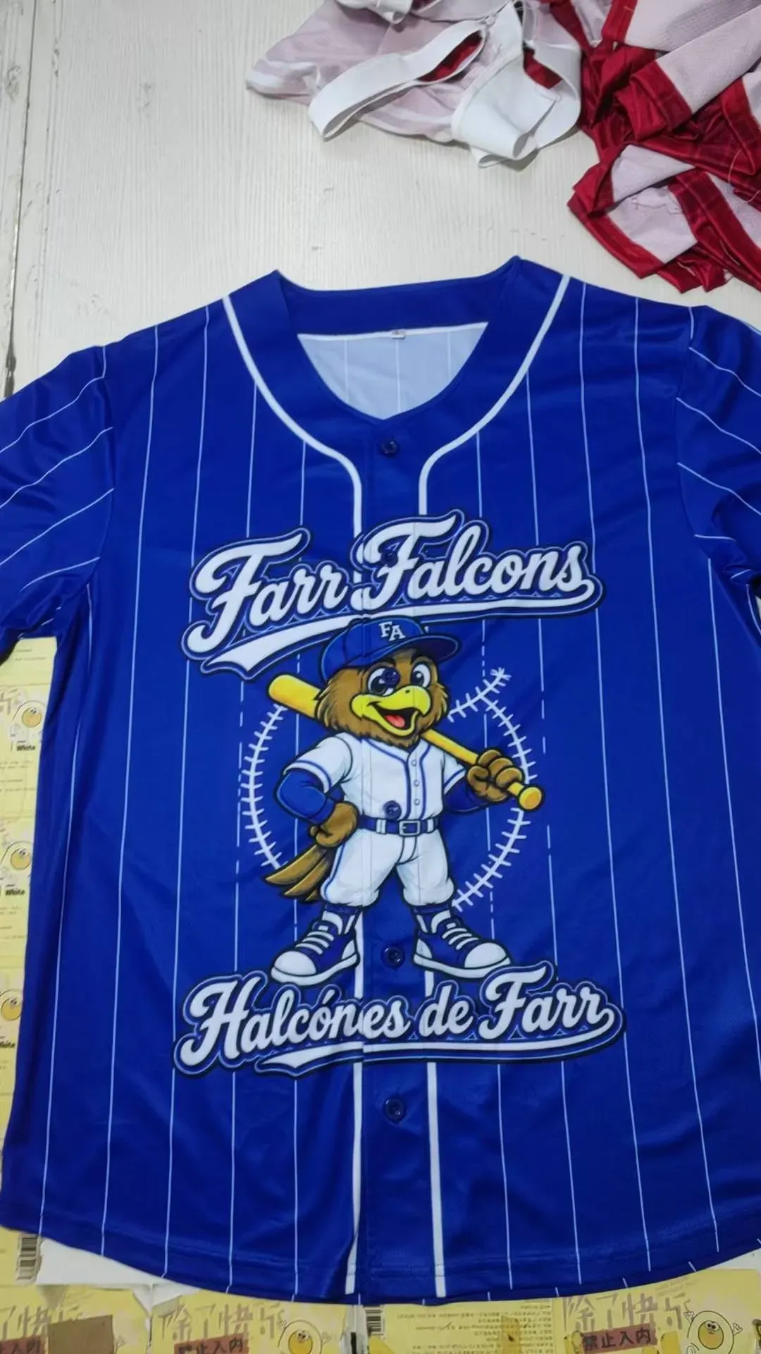 Royal blue pinstripe sublimation baseball jersey with Farr Falcons falcon mascot printed on the chest