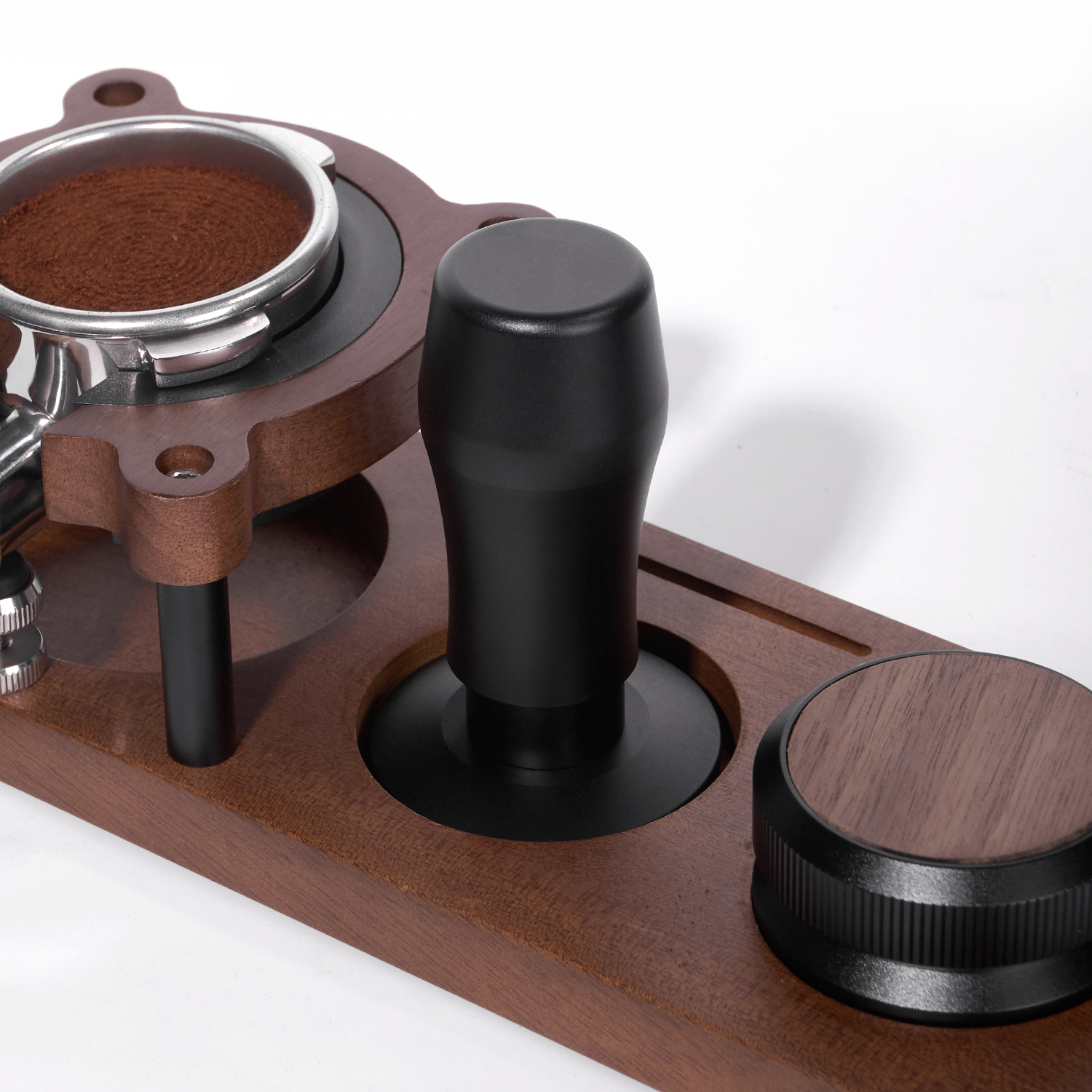 Espresso tamper resting in its separate stand