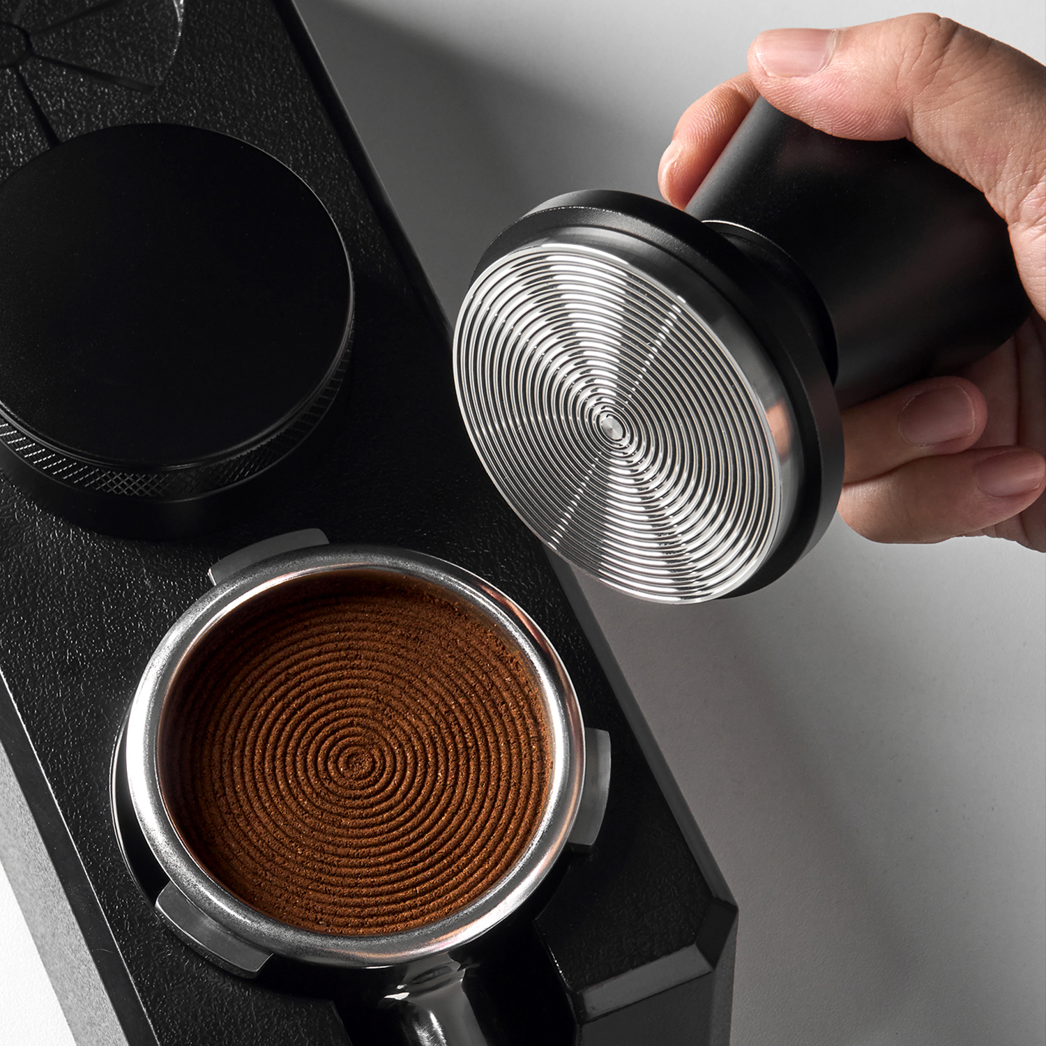 Concentric grooves on the impact tamper base