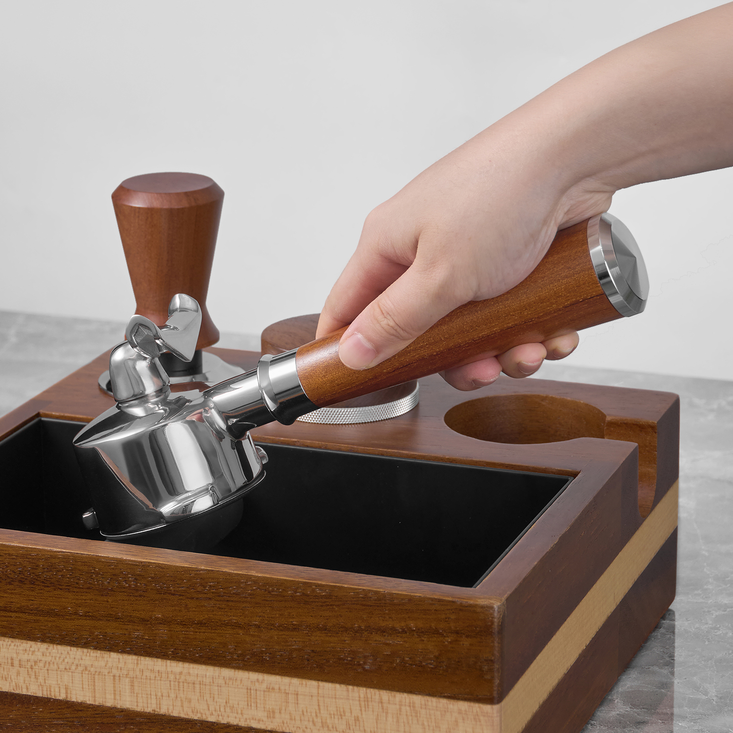 Portafilter used beside a knock box