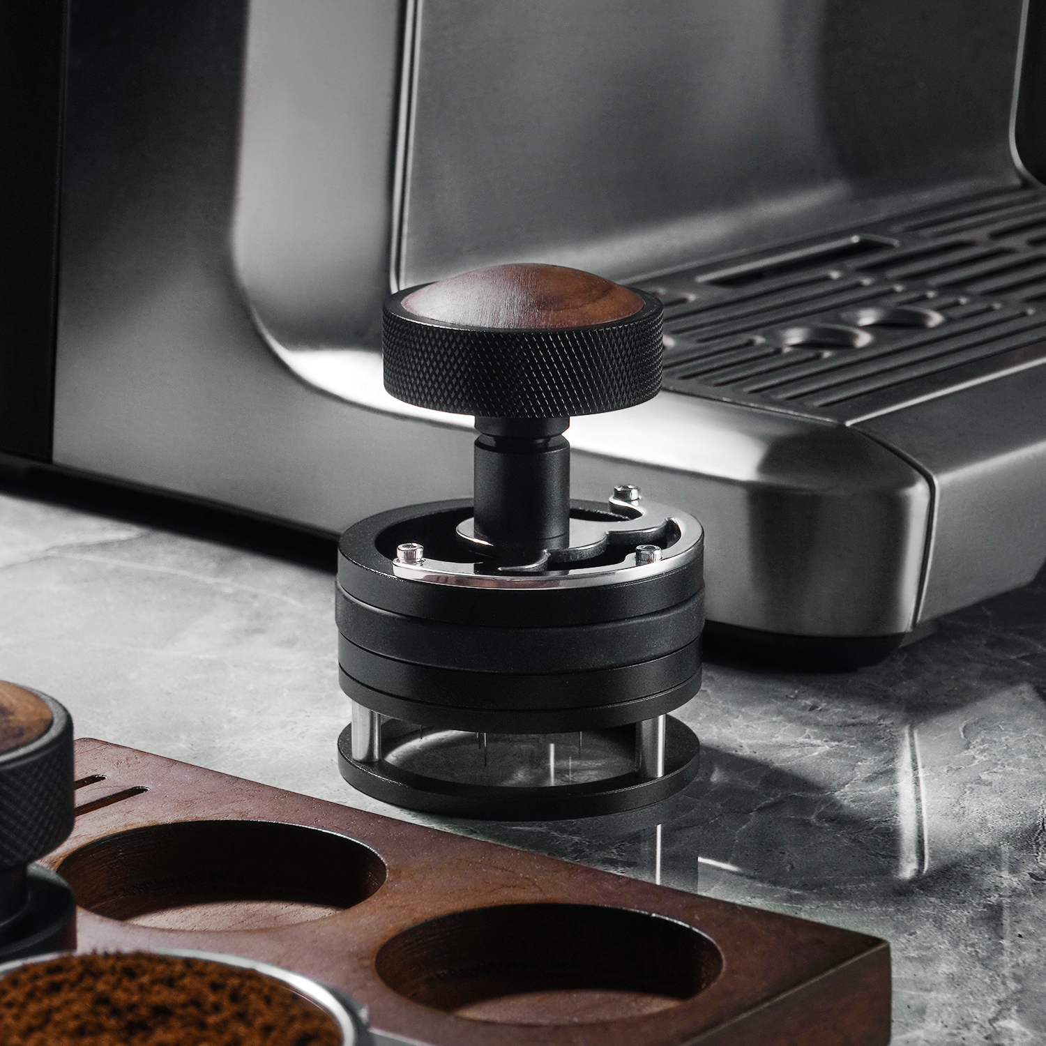 Concentric-path WDT tool beside espresso preparation accessories