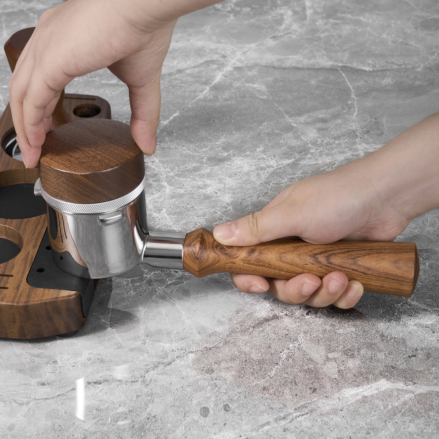 Bottomless portafilter held while tamping