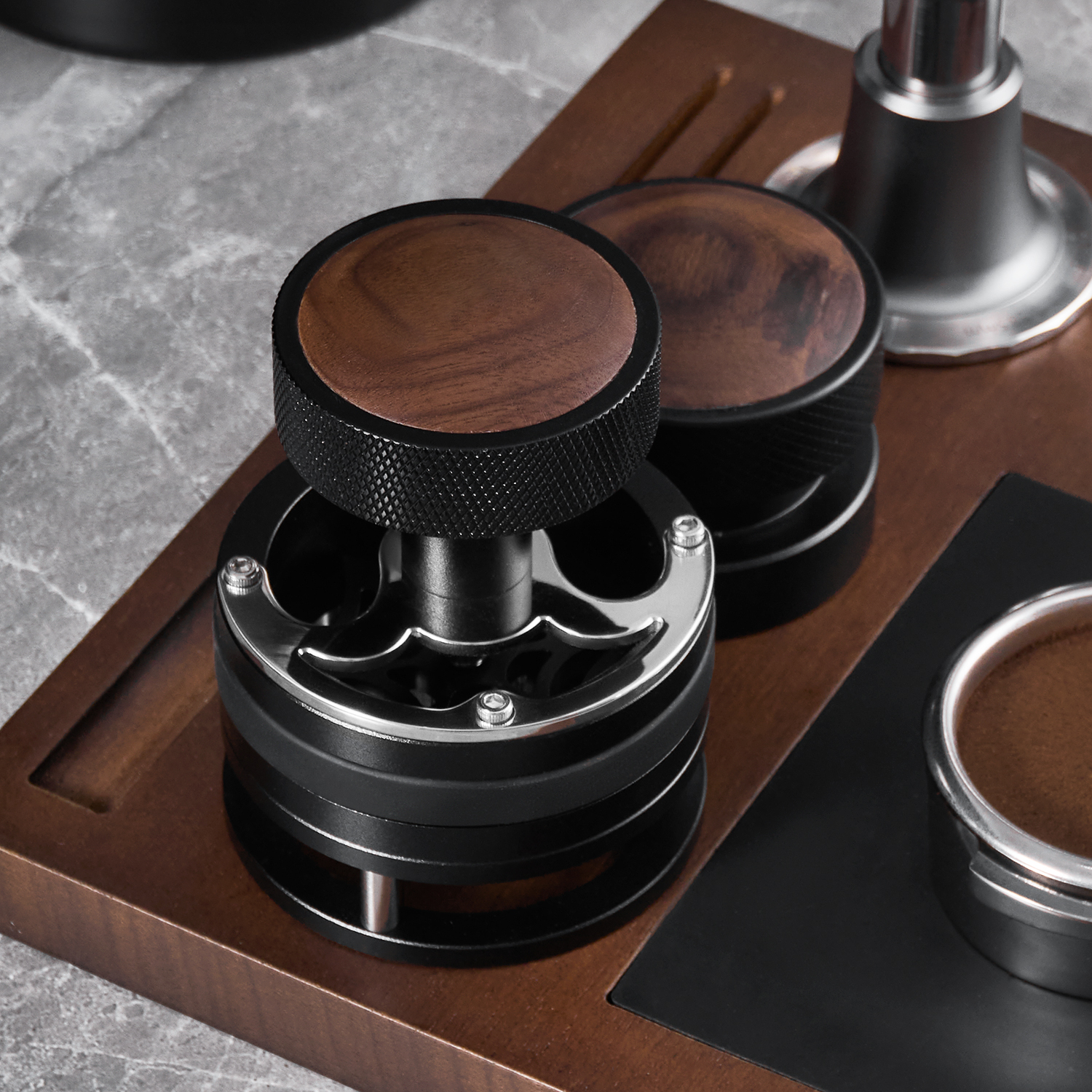 Concentric-path WDT tool beside espresso preparation accessories