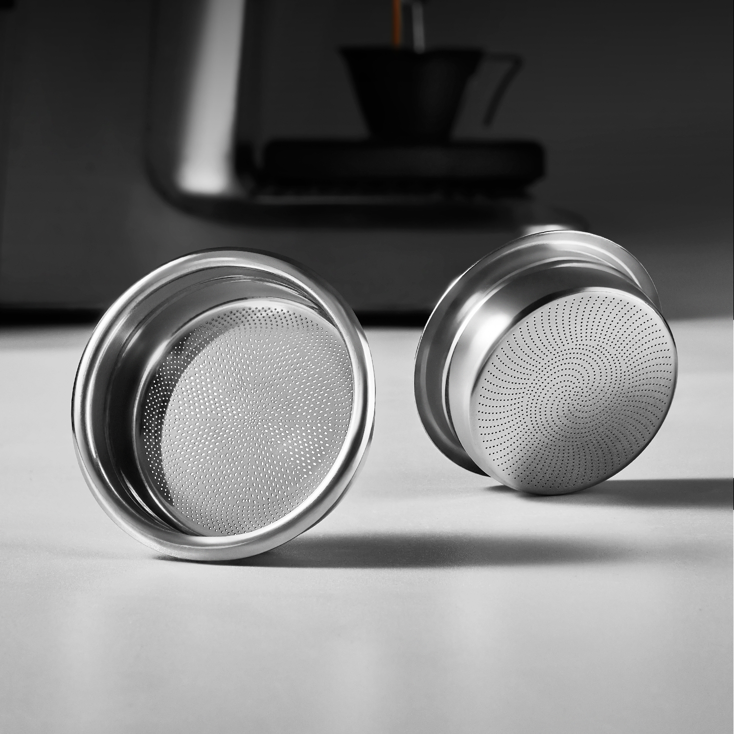 Patterned espresso baskets showing different perforation designs