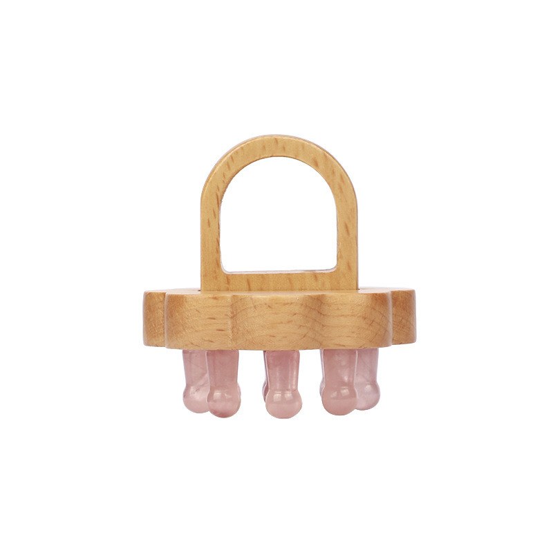 Single lotus comb with rose quartz teeth on white background