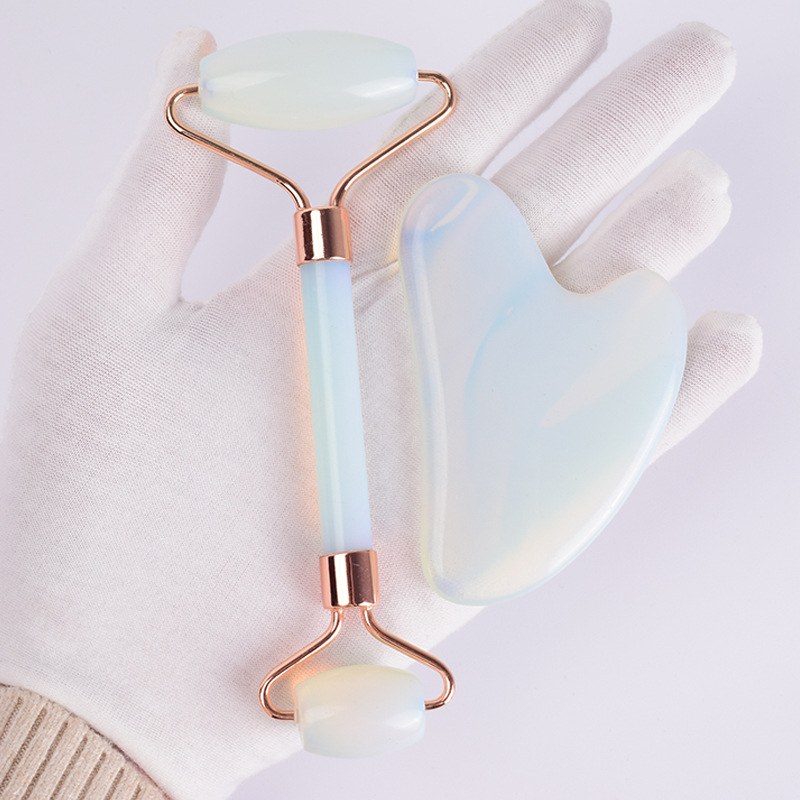 Opalite set held in a white glove