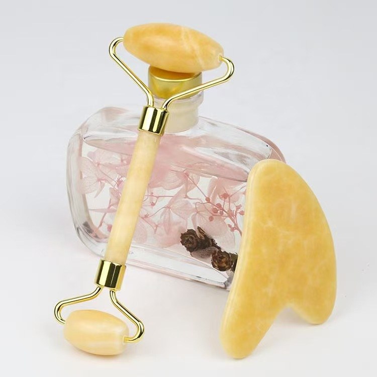 Yellow jade roller and gua sha board styled scene