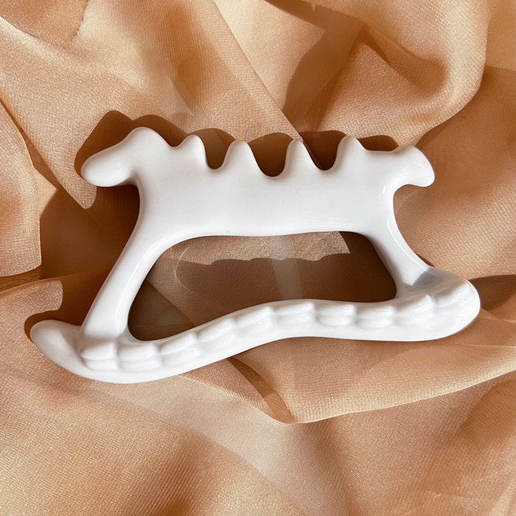 GSK09 Ceramic Bone-Shape Gua Sha Board with Teeth view 2