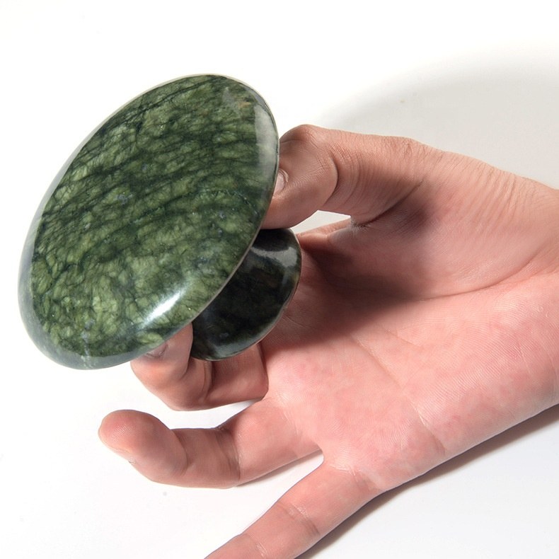Hand holding the large jade mushroom massager