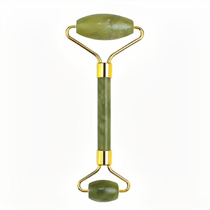 Yellow-green jade face roller close-up