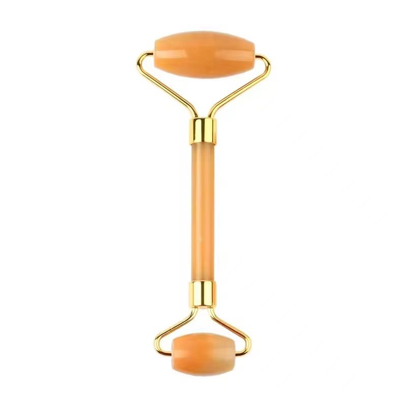Yellow jade gua sha set lifestyle scene with roller