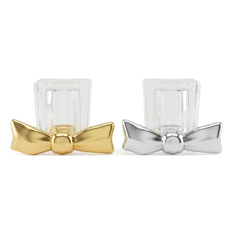 bow perfume caps gold silver pair