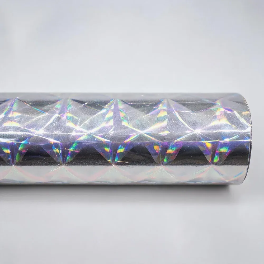 Holographic hot stamping foil with a diamond pattern reflecting rainbow light