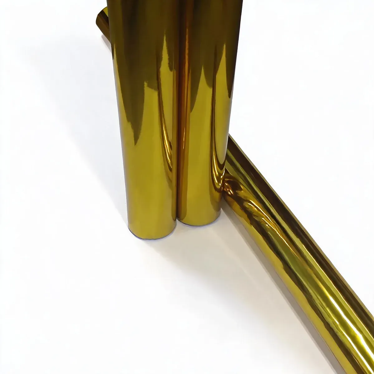 Three rolls of gold and silver cold stamping foil