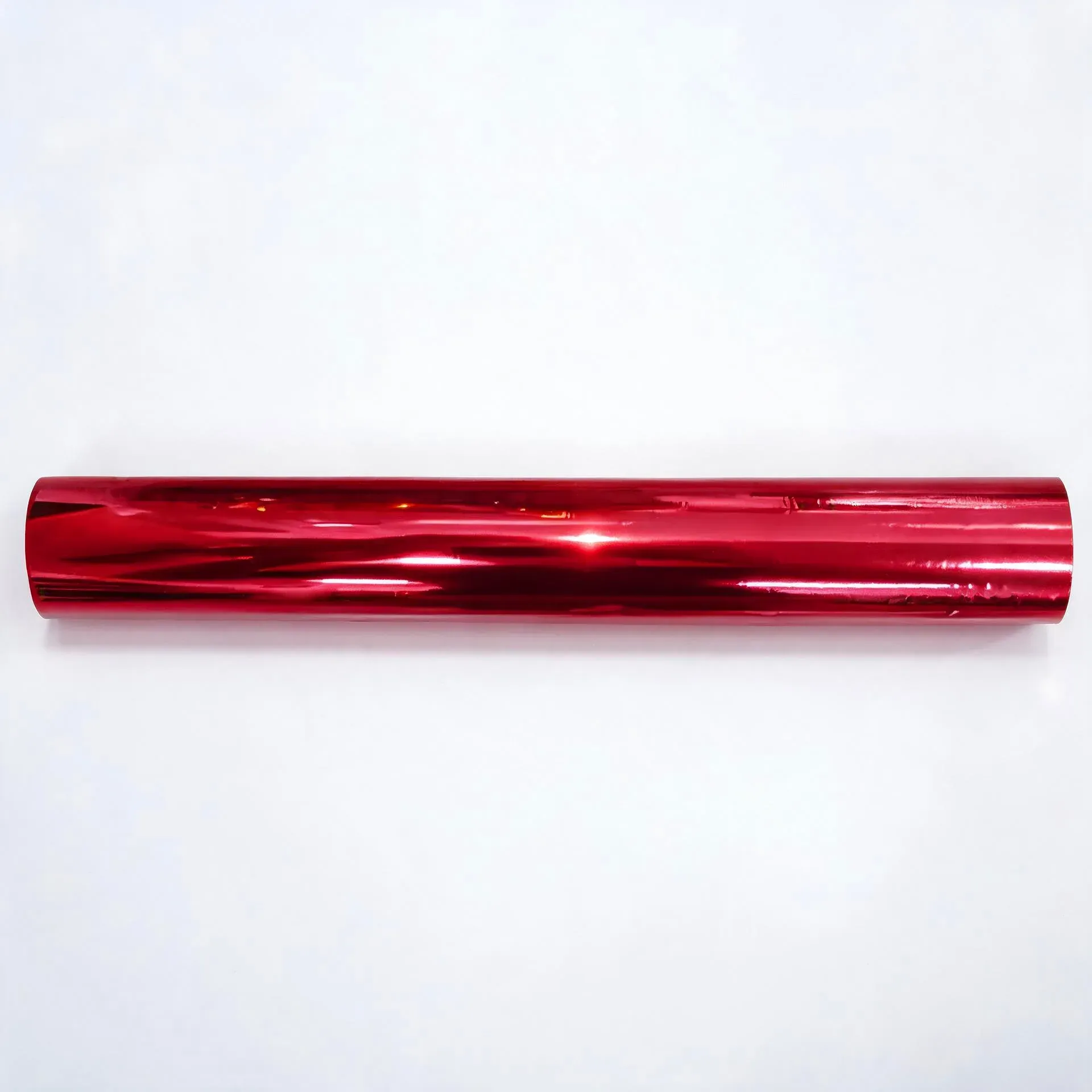 Red coffee-tone hot stamping foil roll on a white background
