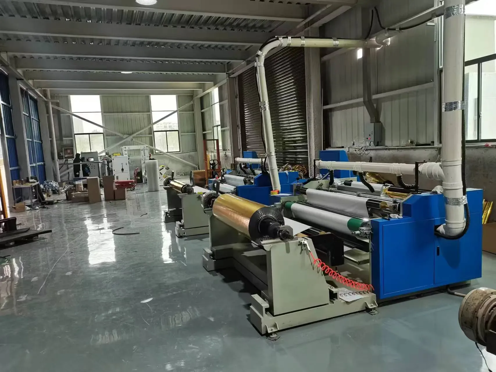 Hot stamping foil production line with gold foil rolls in the factory