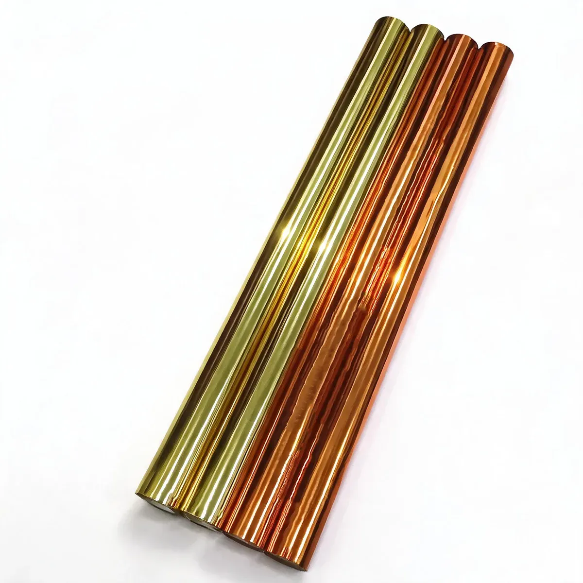 Gold and copper hot stamping foil rolls on a white background