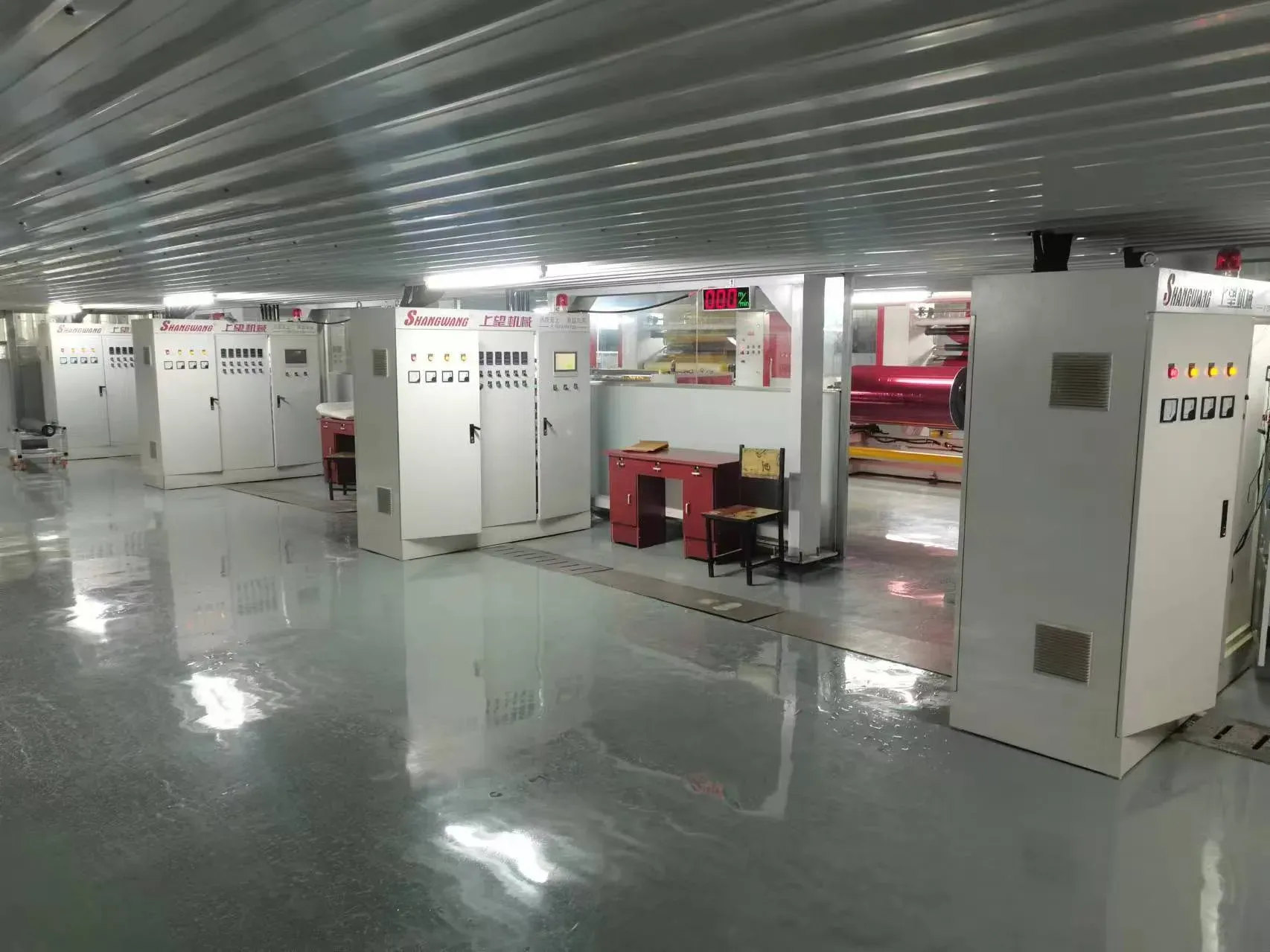 Rows of coating machine control cabinets in the production workshop