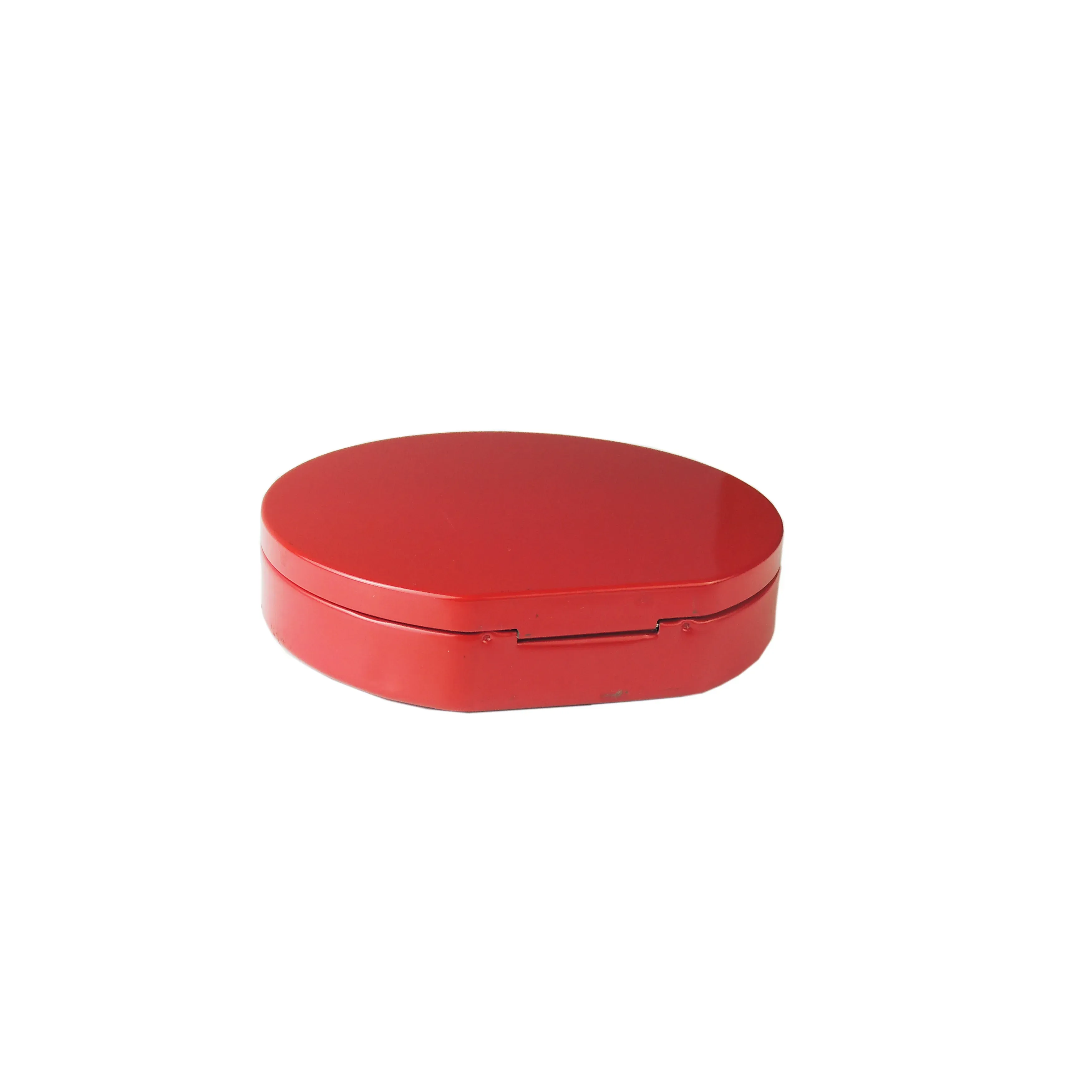 Round red tin from the side showing the lid seam, on a white background