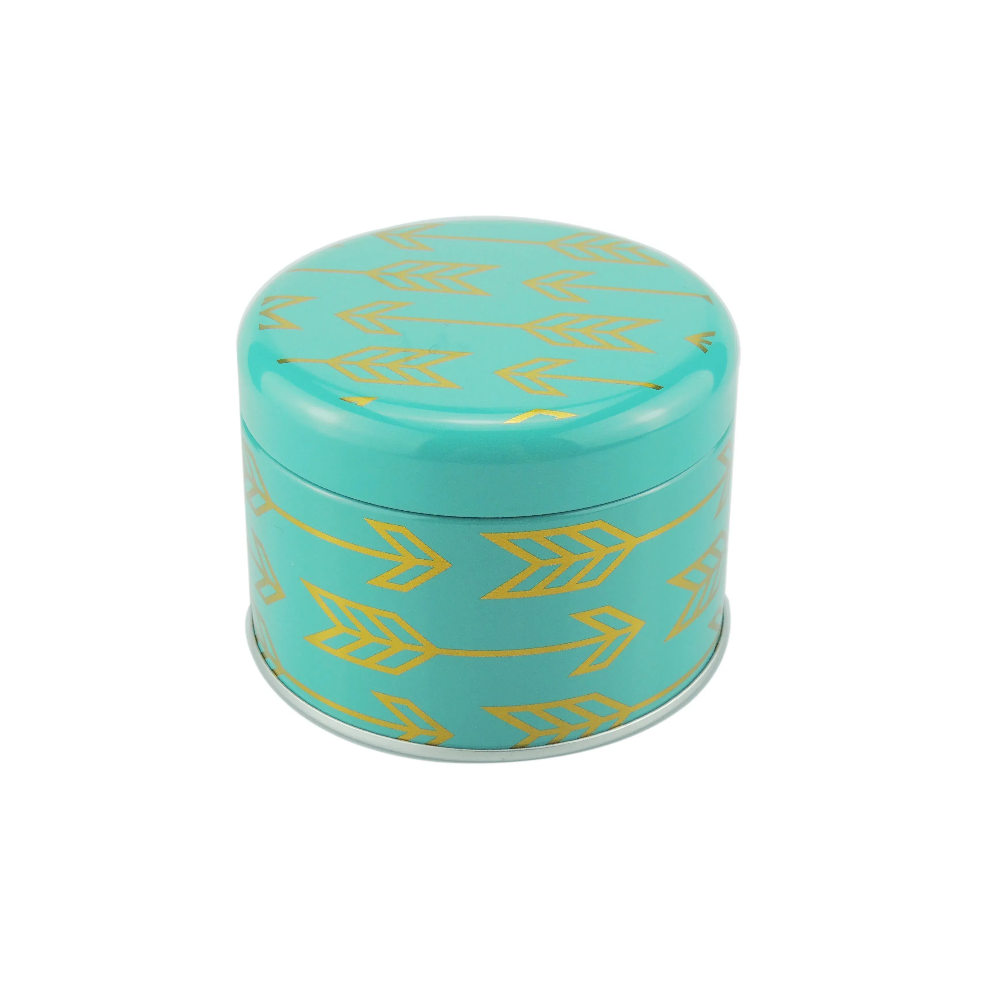 Round tea caddy in teal with a gold arrow pattern, lid fitted