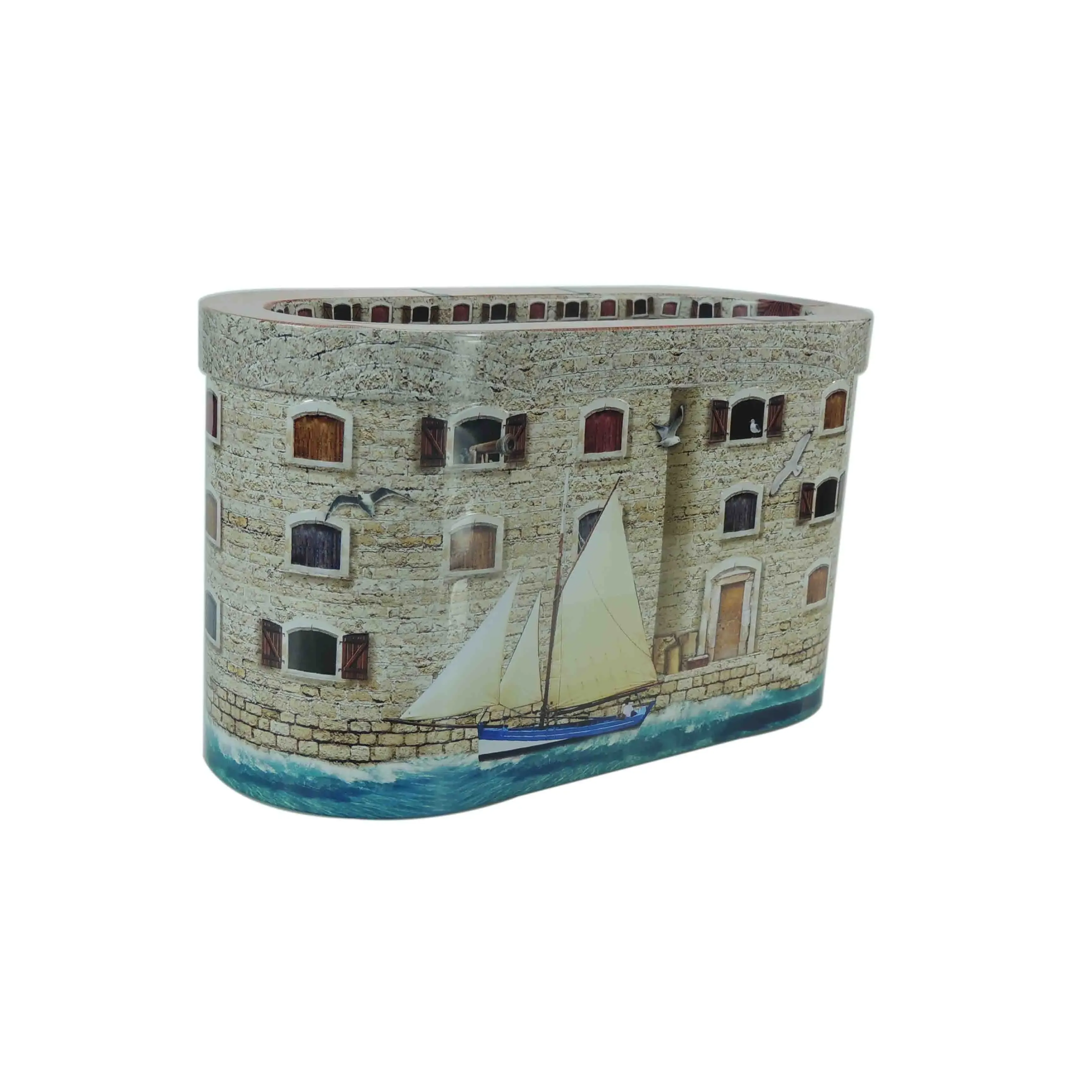 Fort-shaped tin showing the stone-wall print and the boat artwork