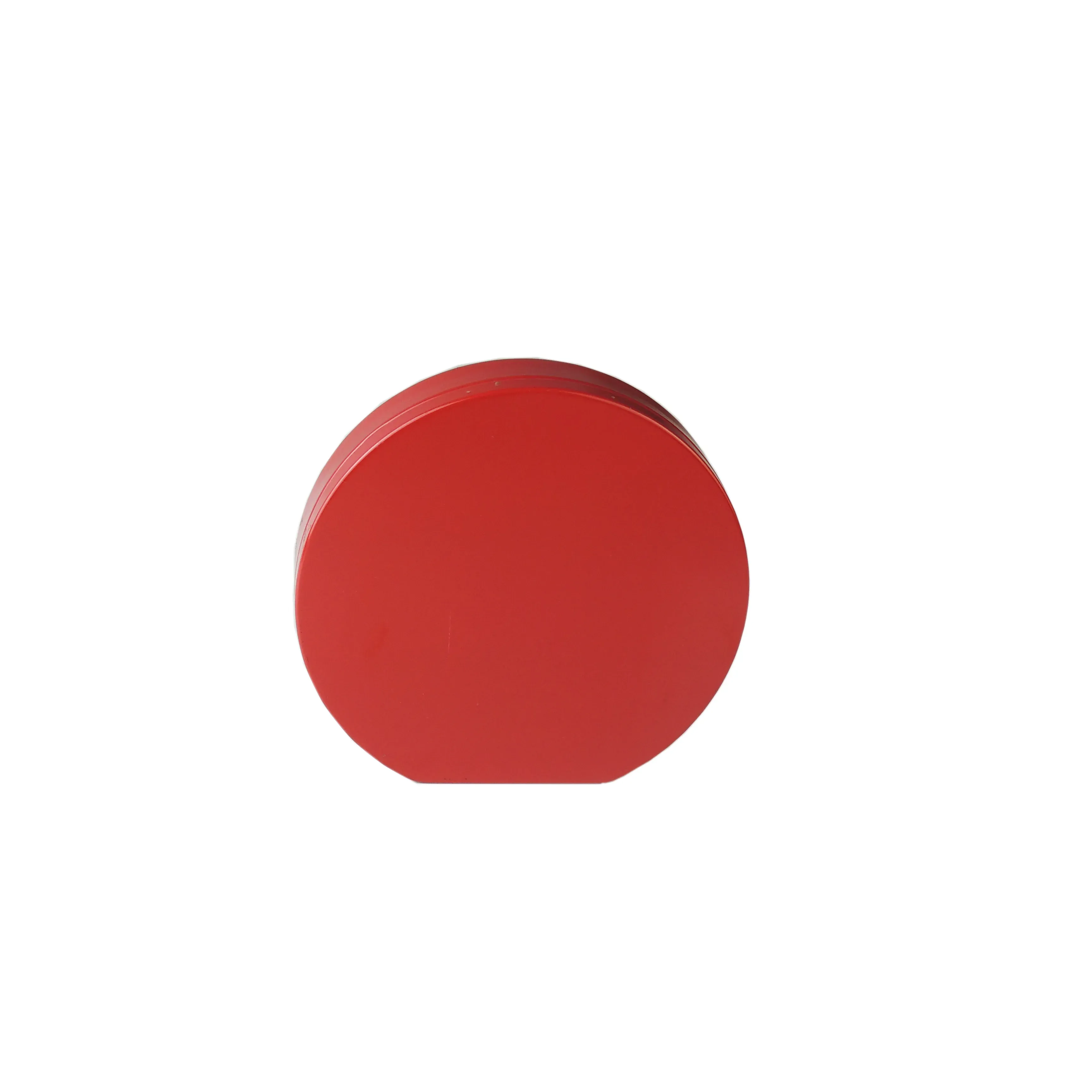 Round red tin seen from above with the lid closed, on a white background