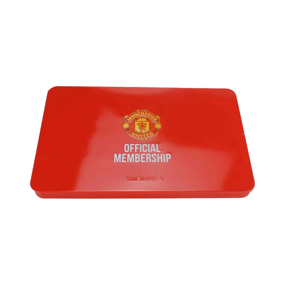 Red slide tin seen from above, printed with a gold crest and lettering, on a white background
