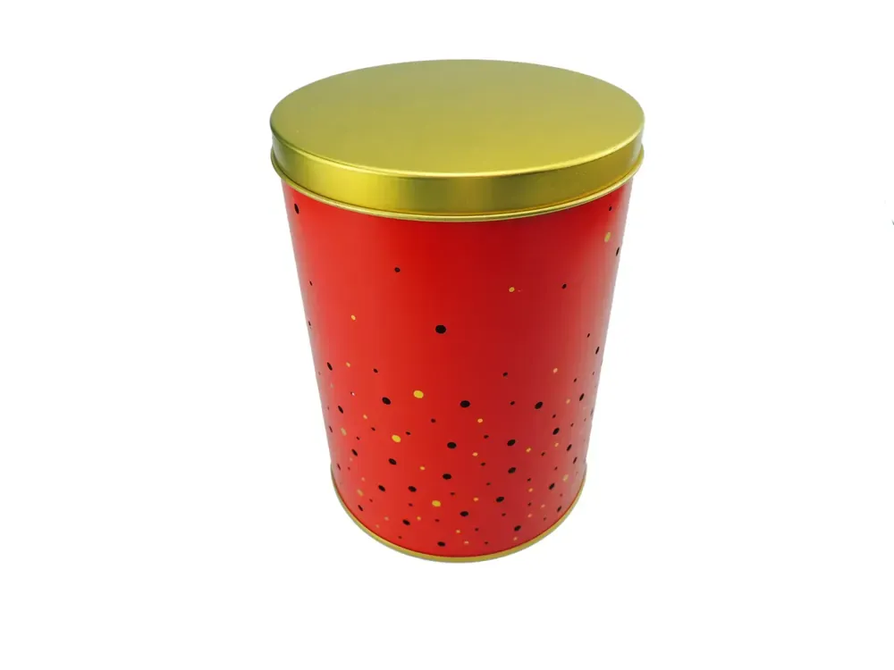 Tapered round candle tin with a gold lid, printed in red with gold and black polka dots