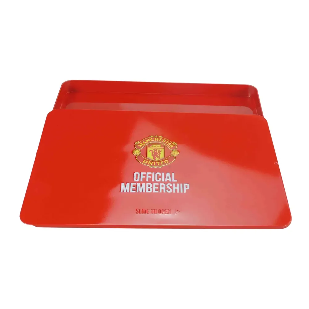 Slide tin opened flat, with the printed lid resting beside the bare tinplate tray, on a white background