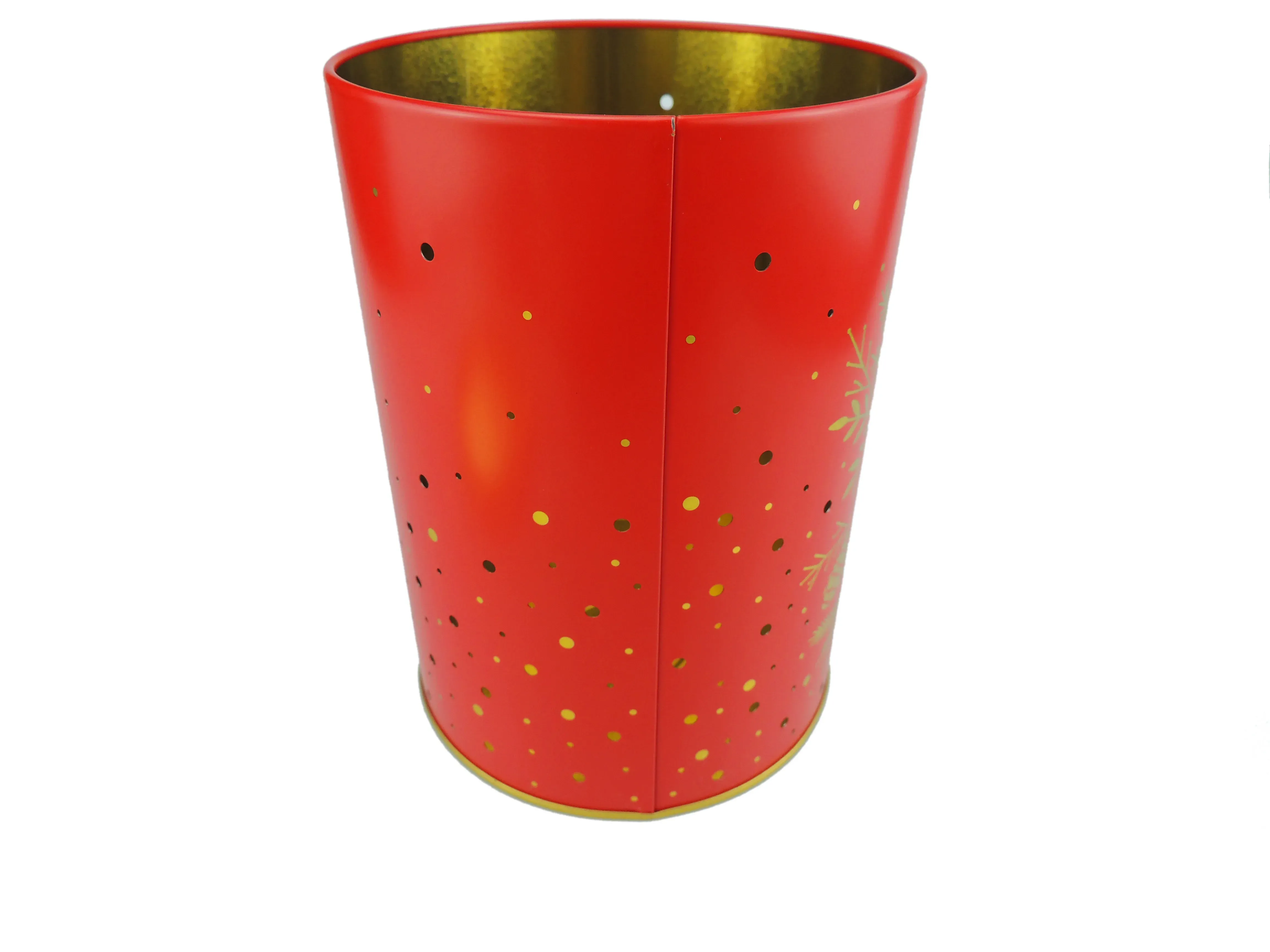 Red candle tin without its lid, showing the gold interior and a gold pine branch print