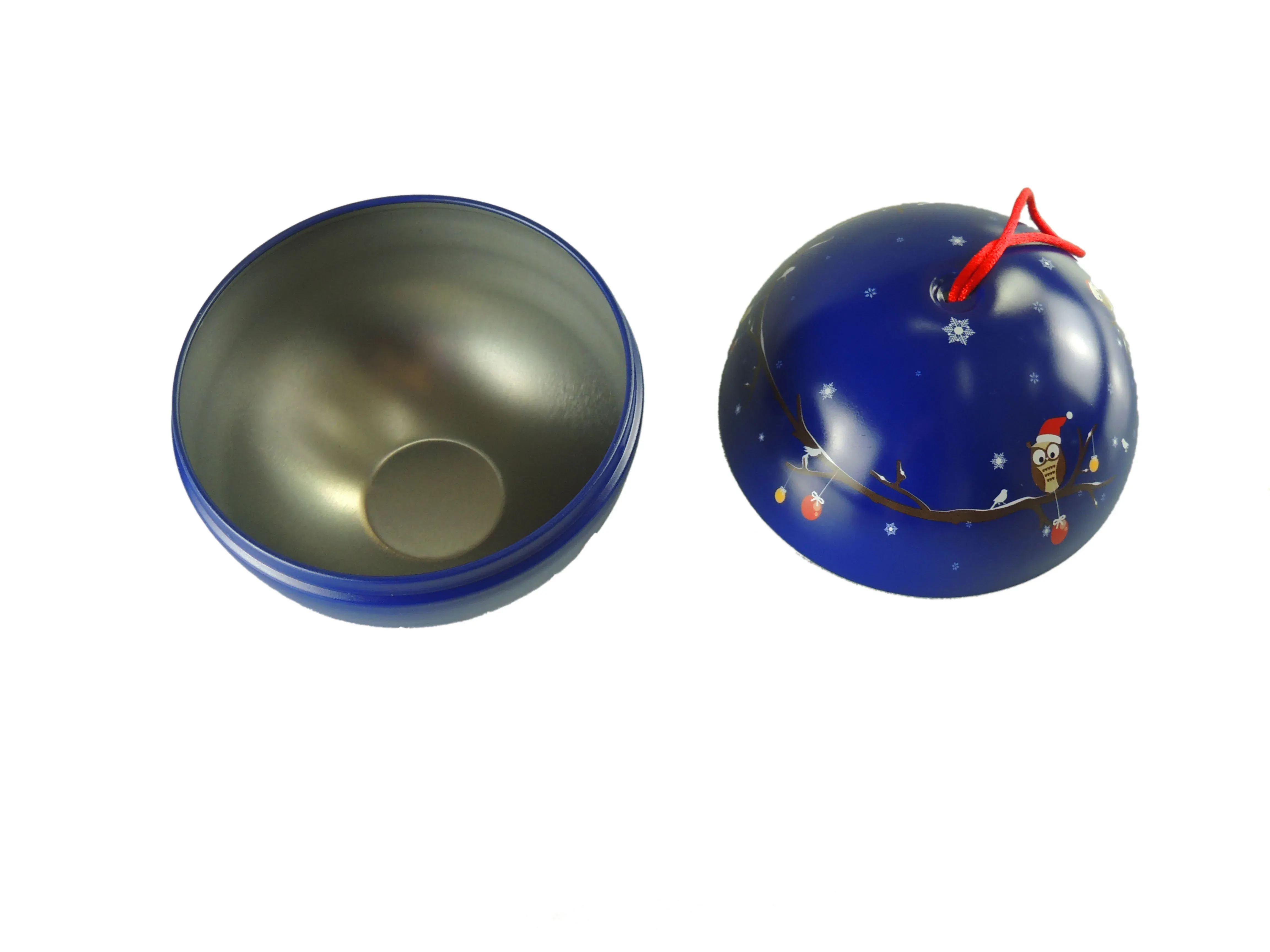 Christmas ball tin opened into two halves, showing the tinplate interior and the blue printed shell