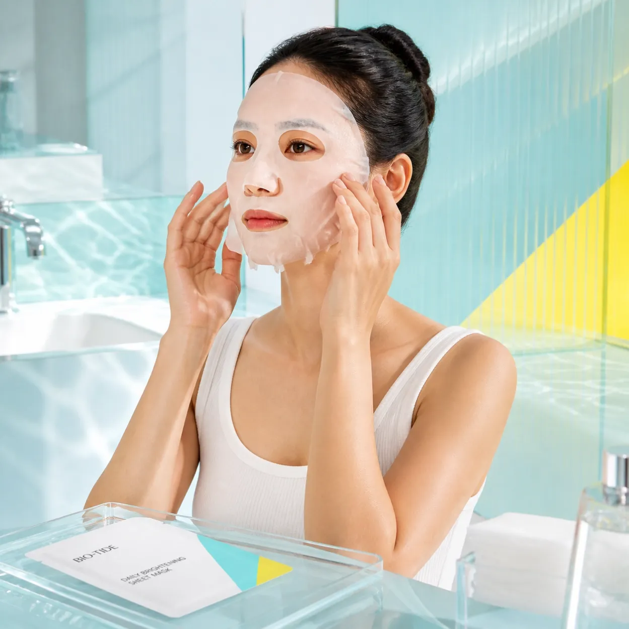 DAILY BRIGHTENING SHEET MASK application in a bright bathroom