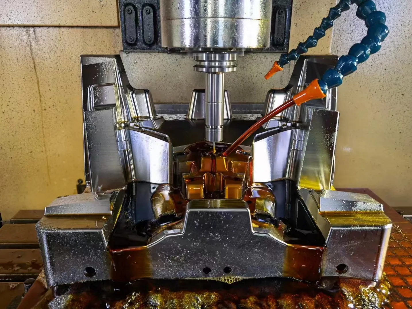 Precision CNC machining of a hardened steel mold core using high-speed milling and oil cooling for Tier-1 quality.