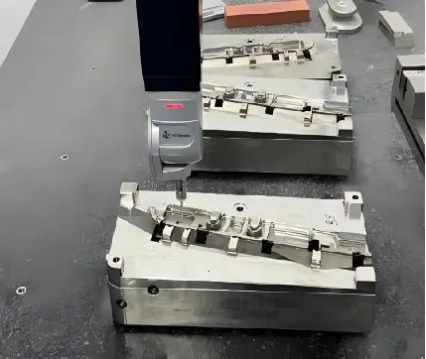 CMM probe inspecting a high-precision mold insert for Tier-1 automotive standards