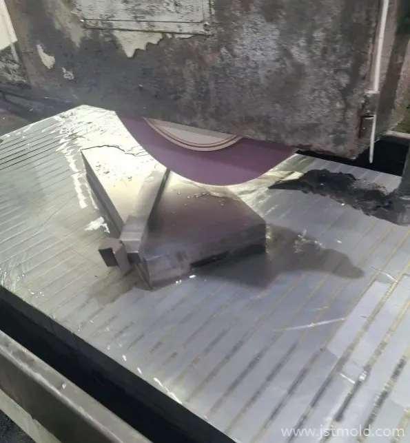 High-precision surface grinding of hardened steel inserts using CBN wheel and coolant synchronization