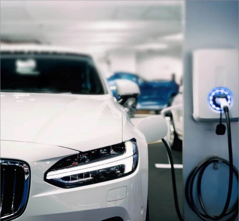 Electric vehicle charging station showing modern NEV infrastructure trends