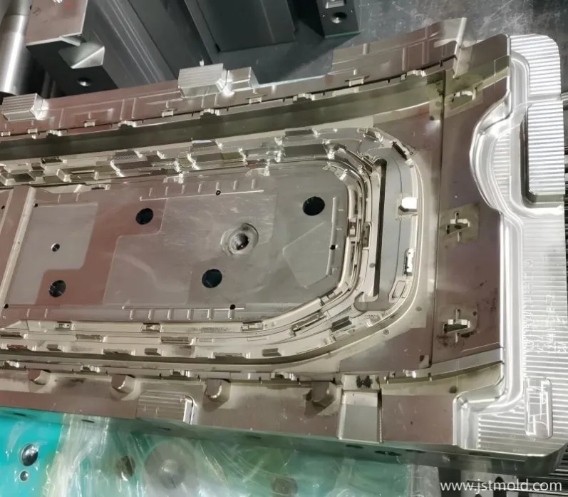 Close-up of high-precision mold inserts with sharp rib definition for automotive PPS GF40 parts, manufactured by JST Mould.