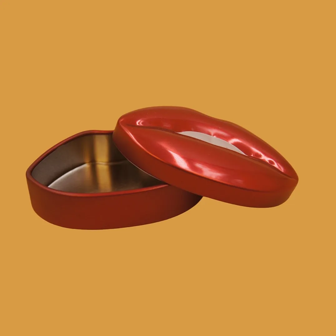 Open red lips tin box angled view