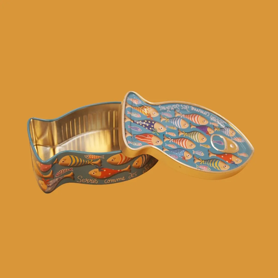Open colorful fish shaped tin box