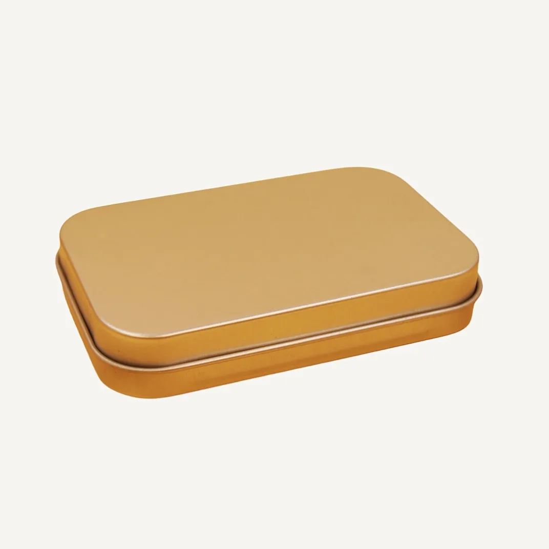 Flat rectangular gold tin box closed lid view