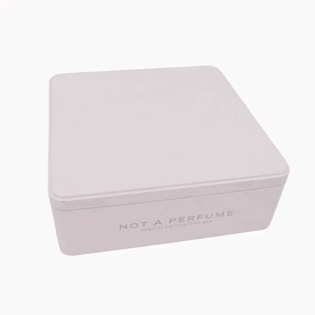 White rectangular perfume tin box with minimal printing
