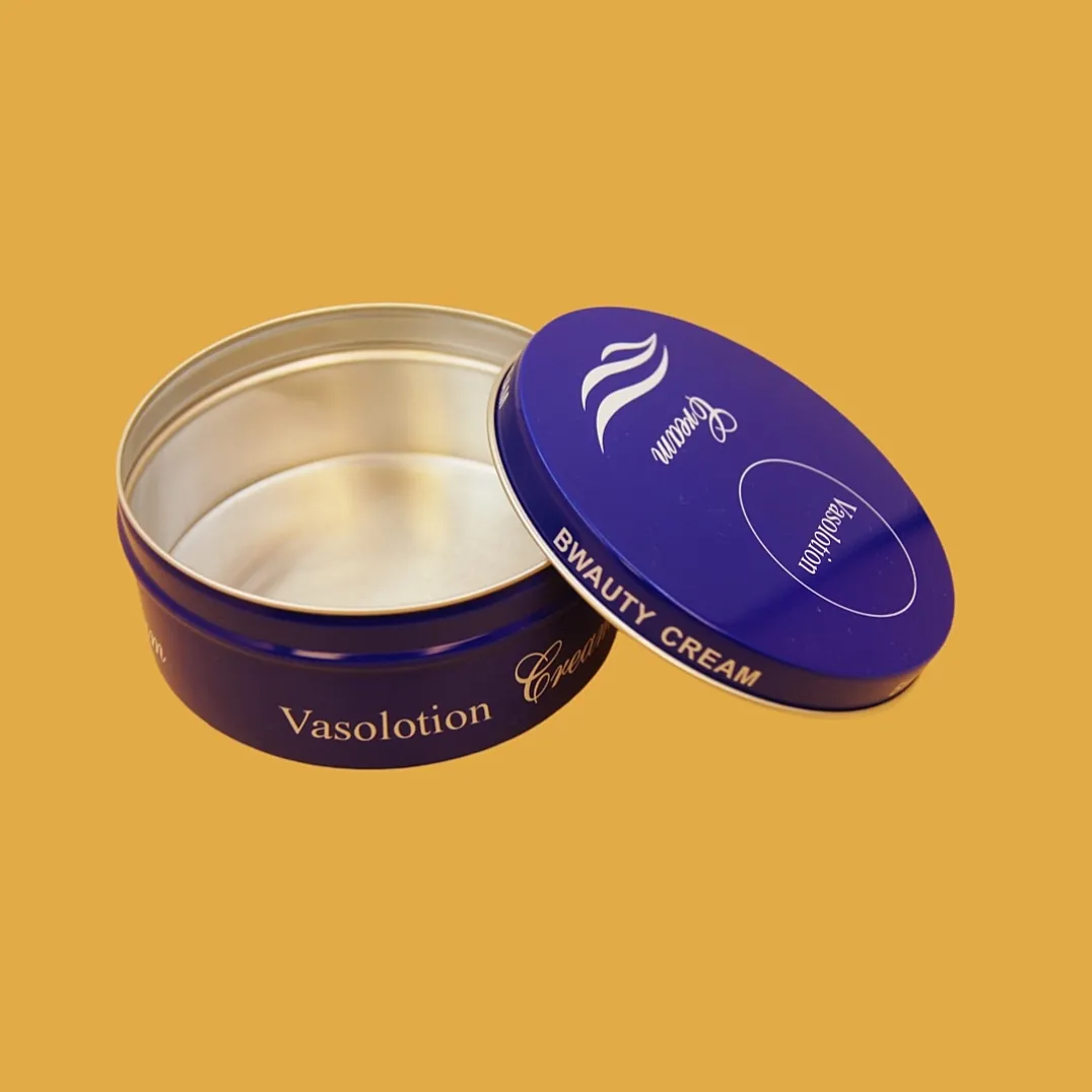 open round blue cookie tin box with silver interior and printed removable lid