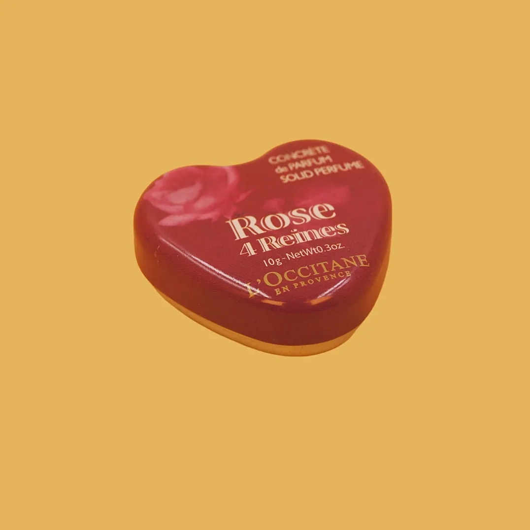Red heart shaped tin box closed view