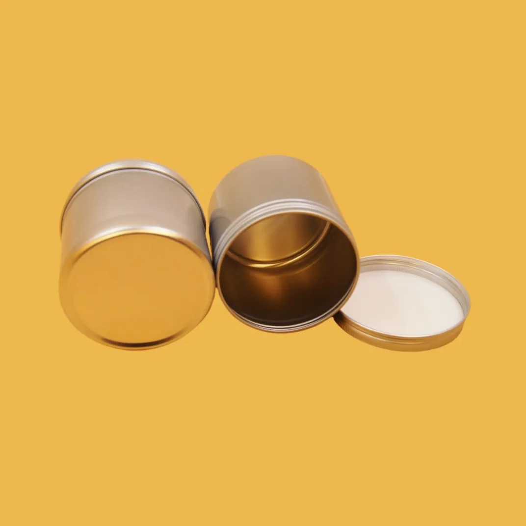 open small round gold tin containers set showing removable lids and plain gold finish
