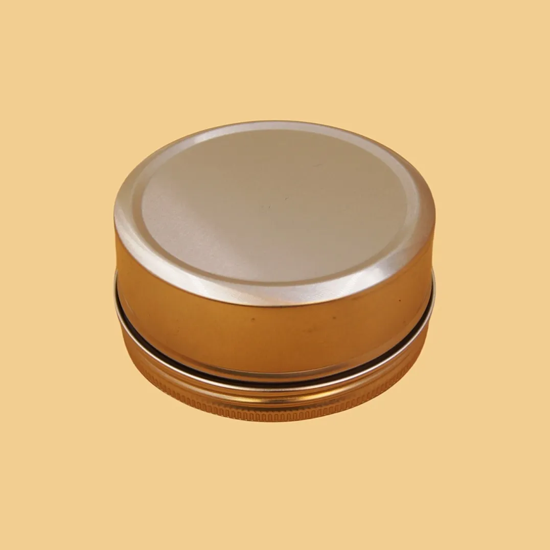 closed bronze round tin box with silver lid for tea, cookies, candy or custom gift packaging