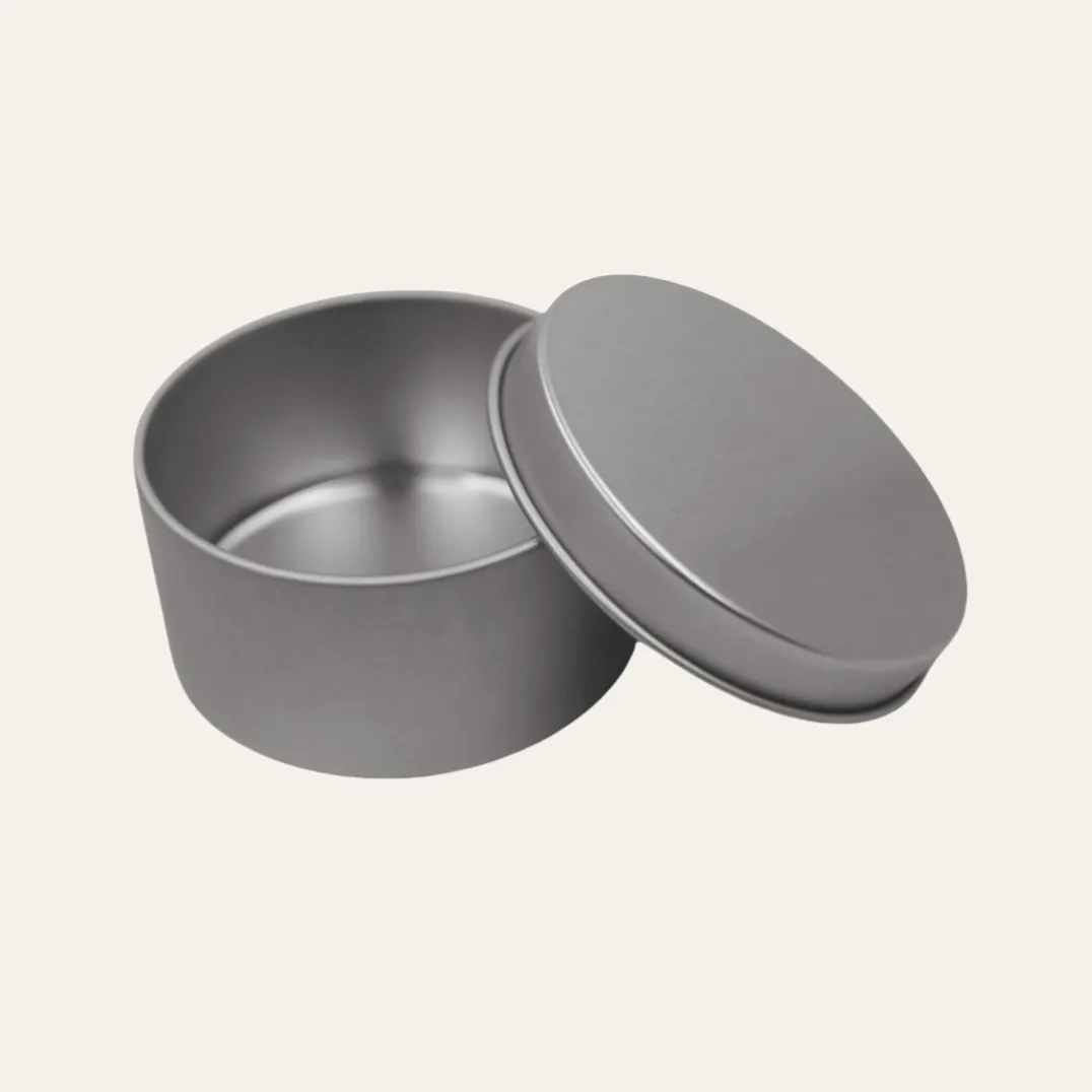 Open round silver metal tin box with lid