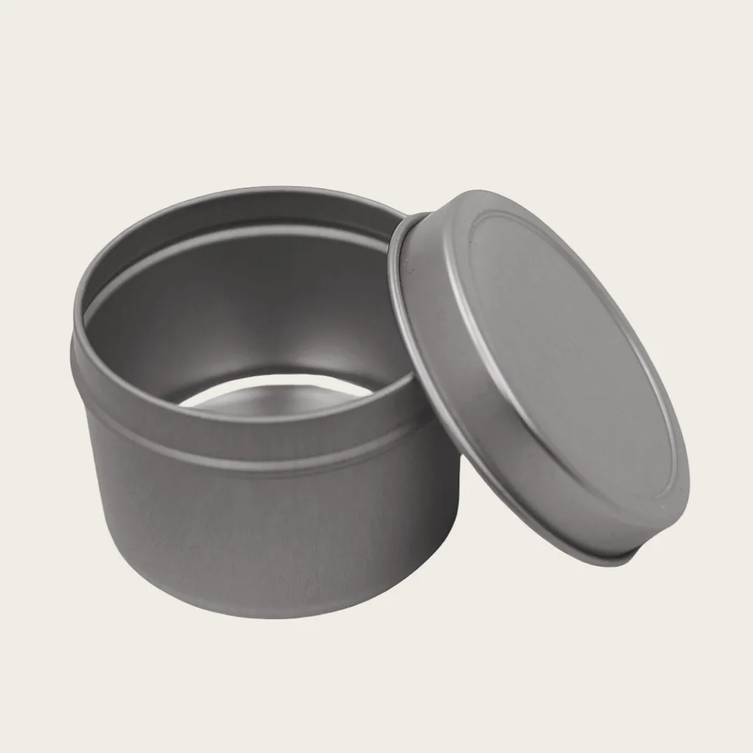 Open round silver tin canister with lid