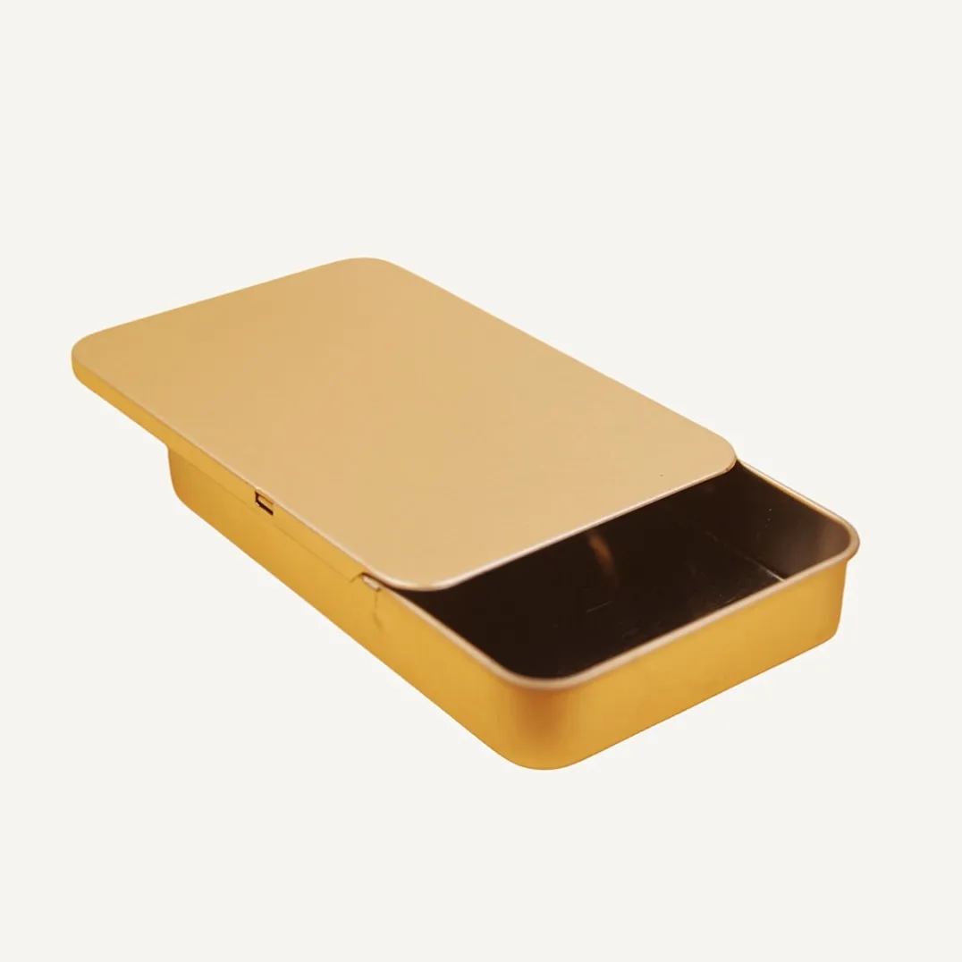 Open flat rectangular gold tin box with sliding lid