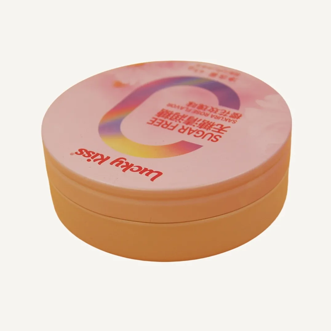 Round pink candy tin box with printed lid